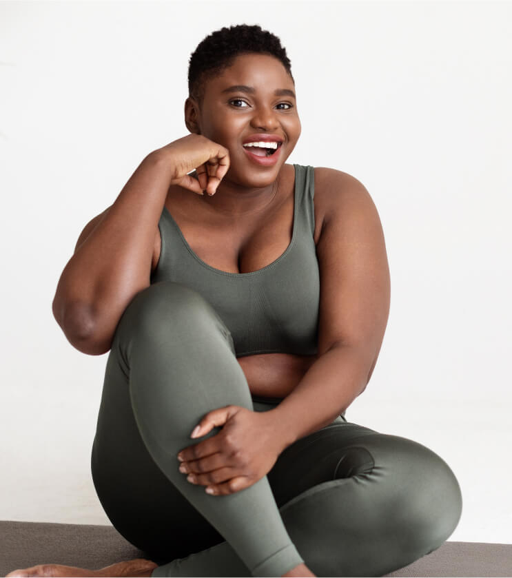 woman-in-sporty-clothes-looking-at-camera-smiling